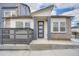 Stylish modern home featuring mixed materials and a well-defined entryway for a contemporary look at 2491 W 69Th Pl, Denver, CO 80221