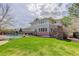 Backyard with a pool, green lawn, and patio, perfect for outdoor gatherings and relaxation at 6724 S Yates Ct, Littleton, CO 80128