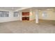 Finished basement featuring a wet bar, recessed lighting, and generous space for various activities at 6724 S Yates Ct, Littleton, CO 80128