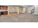 Spacious finished basement with wet bar and carpeting; ideal for entertaining or creating a recreational area at 6724 S Yates Ct, Littleton, CO 80128