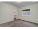 Minimalist bedroom with a walk-in closet and natural light, offering a comfortable and serene atmosphere at 6724 S Yates Ct, Littleton, CO 80128