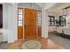 Inviting foyer with hardwood floors, decorative rug, and elegant front door with sidelights at 6724 S Yates Ct, Littleton, CO 80128