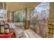 Cozy covered porch perfect for relaxing, with comfortable seating and views of the landscaped front yard at 6724 S Yates Ct, Littleton, CO 80128
