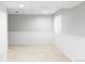 Spacious unfinished basement with carpeting, perfect for storage or future customization at 7680 Elmwood St, Littleton, CO 80125