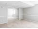 Spacious carpeted bedroom with mirrored closet doors and fresh neutral paint at 7680 Elmwood St, Littleton, CO 80125