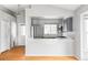 Bright kitchen featuring modern appliances and a large sink at 7680 Elmwood St, Littleton, CO 80125