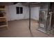 Unfinished basement area with carpet, a window, and exposed utility components for easy access and maintenance at 25669 E Fair Dr, Aurora, CO 80016