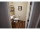 Elegant half-bath with hardwood floors and decorative details at 25669 E Fair Dr, Aurora, CO 80016