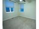 Bedroom with carpeted floors, a ceiling fan, and two windows providing ample natural light at 25669 E Fair Dr, Aurora, CO 80016