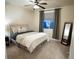 Bedroom with carpeted floors, ceiling fan, and a large window with draperies for light control at 25669 E Fair Dr, Aurora, CO 80016