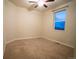 Standard bedroom with carpeted floors, a ceiling fan, and a window offering natural light at 25669 E Fair Dr, Aurora, CO 80016