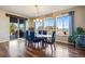 Spacious dining room with sliding door and large windows that fill the space with natural light at 25669 E Fair Dr, Aurora, CO 80016