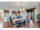 Open-concept dining room leading into the kitchen, perfect for entertaining at 25669 E Fair Dr, Aurora, CO 80016