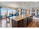 Kitchen island featuring granite countertops and views of the dining and living rooms at 25669 E Fair Dr, Aurora, CO 80016