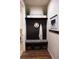 Cozy mudroom with storage bench, hooks, and decorative welcome decor at 25669 E Fair Dr, Aurora, CO 80016