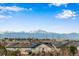 Scenic view of rooftops with snow-capped mountains in the background, showcasing the neighborhood's beauty at 25669 E Fair Dr, Aurora, CO 80016