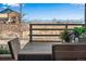 Cozy deck scene featuring a dining table with scenic mountain views in the background at 25669 E Fair Dr, Aurora, CO 80016