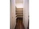 Walk-in pantry with custom shelving and hardwood flooring at 25669 E Fair Dr, Aurora, CO 80016