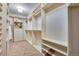 Organized walk-in closet featuring built-in shelving and ample storage space at 25669 E Fair Dr, Aurora, CO 80016