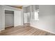 A bedroom with wood floors, sliding closet doors, and neutral wall colors provides a calming atmosphere at 4621 S Fraser Cir # B, Aurora, CO 80015