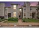 Charming townhome with well-maintained lawn and neutral siding at dusk at 4621 S Fraser Cir # B, Aurora, CO 80015