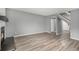 Open living room featuring hardwood floors, fireplace, and staircase at 4621 S Fraser Cir # B, Aurora, CO 80015