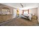 Bright bedroom with ceiling fan and dresser at 14734 E Evans Pl, Aurora, CO 80014