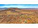 Stunning aerial view of rolling hills and scattered homes at 1552 Colt Cir, Castle Rock, CO 80109