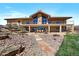 Large backyard with a patio and stairs leading up to the house at 1552 Colt Cir, Castle Rock, CO 80109