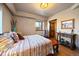 Cozy bedroom with colorful accents, a decorative vase, and natural light at 1552 Colt Cir, Castle Rock, CO 80109