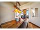 Dining room showcasing rustic table and bench with living room and fireplace visible in the background at 1552 Colt Cir, Castle Rock, CO 80109