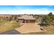 Expansive property showcasing landscaping, hardscaping and an attached three-car garage at 1552 Colt Cir, Castle Rock, CO 80109