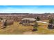 Expansive home boasts mature landscaping, stone accents and spectacular views of the surrounding area at 1552 Colt Cir, Castle Rock, CO 80109