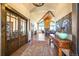 Bright and spacious foyer features hardwood floors, high ceilings, a stone fireplace, and large windows at 1552 Colt Cir, Castle Rock, CO 80109