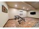 Home gym with weight bench and free weights on a neutral colored carpet at 1552 Colt Cir, Castle Rock, CO 80109