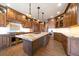 Contemporary kitchen featuring custom wood cabinets, a large island, and state-of-the-art appliances at 1552 Colt Cir, Castle Rock, CO 80109
