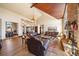 Expansive living room features vaulted wood ceilings, stone fireplace, and hardwood floors at 1552 Colt Cir, Castle Rock, CO 80109