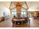 A spacious living room with a stone fireplace, a vaulted ceiling, hardwood floors, and furniture sets at 1552 Colt Cir, Castle Rock, CO 80109