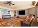 This living room features hardwood floors, leather chairs, a fireplace and media center at 1552 Colt Cir, Castle Rock, CO 80109