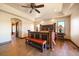 This spacious primary bedroom offers an ensuite bath and charming rustic furnishings at 1552 Colt Cir, Castle Rock, CO 80109