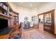 Comfortable office space with hardwood floors, custom cabinets and shelving, with plenty of space at 1552 Colt Cir, Castle Rock, CO 80109