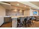 Entertain in style with this wet bar, featuring a marble counter and rustic wooden accents at 1552 Colt Cir, Castle Rock, CO 80109