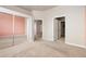 Spacious bedroom featuring two closets and multiple doorways at 15475 Andrews Dr # 412, Denver, CO 80239