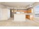 Open concept kitchen with breakfast bar and modern appliances at 15475 Andrews Dr # 412, Denver, CO 80239
