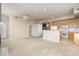 Open layout living room with cozy fireplace and views at 15475 Andrews Dr # 412, Denver, CO 80239