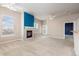 Cozy living area featuring a fireplace and ample natural light at 15475 Andrews Dr # 412, Denver, CO 80239
