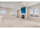 Spacious living area with lots of natural light and a cozy fireplace at 15475 Andrews Dr # 412, Denver, CO 80239