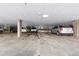 Spacious parking garage with multiple cars parked under a well-lit ceiling at 15475 Andrews Dr # 412, Denver, CO 80239