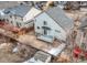 Aerial view of home with a deck, well-maintained backyard, a storage shed, and mature trees at 257 Cherry St, Castle Rock, CO 80104