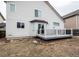 Back of the home with an outdoor deck, landscaping, and natural light at 257 Cherry St, Castle Rock, CO 80104